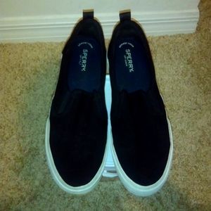 Black Sperry slip on
